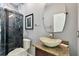 Stylish bathroom showcasing a modern vessel sink and a glass-enclosed shower at 27012 Sea Breeze Way, Wesley Chapel, FL 33544