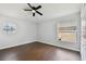 Bright bedroom with hardwood floors, ceiling fan, and dual windows with great natural light at 27012 Sea Breeze Way, Wesley Chapel, FL 33544