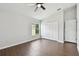 Bright bedroom features vaulted ceiling, modern ceiling fan, wood floors, and natural light at 27012 Sea Breeze Way, Wesley Chapel, FL 33544