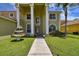 Eye-catching front entrance to home featuring a walkway and a decorative fountain at 27012 Sea Breeze Way, Wesley Chapel, FL 33544