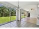 Open floor plan with sliding glass doors leading to a backyard at 27012 Sea Breeze Way, Wesley Chapel, FL 33544