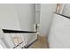 Carpeted staircase with white railings leads to the upper floor at 27012 Sea Breeze Way, Wesley Chapel, FL 33544
