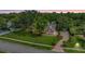 Sprawling estate featuring lush green lawns, mature landscaping, and a circular driveway at 2769 St Andrews Blvd, Tarpon Springs, FL 34688
