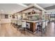 Clubhouse bar area with countertop seating, wooden trim, and mirrored wall at 2769 St Andrews Blvd, Tarpon Springs, FL 34688
