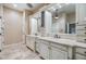 Bright bathroom with double vanities and marble countertops at 2769 St Andrews Blvd, Tarpon Springs, FL 34688