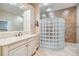 Bathroom features a glass block shower and tiled walls at 2769 St Andrews Blvd, Tarpon Springs, FL 34688