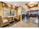The breakfast nook features a built-in booth, table, and access to the outdoor area, adjacent to the full bar area at 2769 St Andrews Blvd, Tarpon Springs, FL 34688