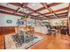 Dining room area with wooden ceiling beams, hardwood floors, and a dining room table at 2769 St Andrews Blvd, Tarpon Springs, FL 34688