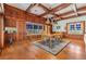 Dining room with hardwood floors, wood paneling, and custom cabinets with windows at 2769 St Andrews Blvd, Tarpon Springs, FL 34688