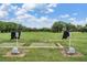 Scenic view of the driving range with hitting mats and expansive green at 2769 St Andrews Blvd, Tarpon Springs, FL 34688
