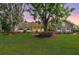 Beautiful two-story home featuring a manicured lawn and mature trees providing shade at 2769 St Andrews Blvd, Tarpon Springs, FL 34688