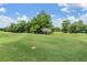 Expansive view of the golf course, showcasing its lush green fairways and mature trees at 2769 St Andrews Blvd, Tarpon Springs, FL 34688