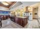 Gourmet kitchen features a center island, granite countertops, and stainless steel appliances at 2769 St Andrews Blvd, Tarpon Springs, FL 34688