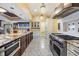 Updated kitchen featuring granite countertops, stainless steel appliances, and ample counter space at 2769 St Andrews Blvd, Tarpon Springs, FL 34688