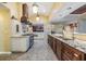 Modern kitchen with granite counters, stainless steel appliances and seamless transition to the living spaces at 2769 St Andrews Blvd, Tarpon Springs, FL 34688
