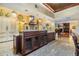 Open kitchen features a large island, granite countertops, and a seamless transition to the living spaces at 2769 St Andrews Blvd, Tarpon Springs, FL 34688