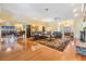 Spacious living room features an ornate rug, hardwood floors, and plenty of natural light at 2769 St Andrews Blvd, Tarpon Springs, FL 34688