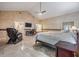 Large main bedroom with sitting area and tile flooring at 2769 St Andrews Blvd, Tarpon Springs, FL 34688