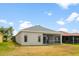Spacious backyard featuring a screened lanai, offering a comfortable outdoor living space at 2814 Graphite Ct, Valrico, FL 33594