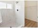 Bathroom showcases tile shower and neutral walls, leading to walk-in closet at 2814 Graphite Ct, Valrico, FL 33594