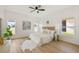 Bright bedroom with light floors, neutral walls, and many windows overlooking the property's landscape at 2814 Graphite Ct, Valrico, FL 33594