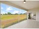 Screened lanai features tile flooring and unobstructed views of the golf course at 2814 Graphite Ct, Valrico, FL 33594