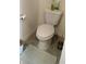 Cozy bathroom with a standard toilet and neutral decor at 2880 Gumbo Limbo Dr, Wimauma, FL 33598