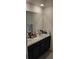 Bathroom featuring double sinks and vanity with plenty of storage space at 2880 Gumbo Limbo Dr, Wimauma, FL 33598