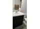 Bathroom vanity featuring granite countertops and a dark wood cabinet base with a toilet at 2880 Gumbo Limbo Dr, Wimauma, FL 33598