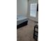 Bedroom featuring neutral carpeting, a window with blinds, and TV at 2880 Gumbo Limbo Dr, Wimauma, FL 33598