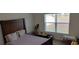 Comfortable bedroom with a large window at 2880 Gumbo Limbo Dr, Wimauma, FL 33598