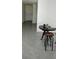 Dining area features tile flooring, table with barstool seating, and neutral paint at 2880 Gumbo Limbo Dr, Wimauma, FL 33598