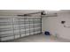 Clean garage interior featuring a functional garage door and concrete flooring at 2880 Gumbo Limbo Dr, Wimauma, FL 33598
