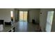 Bright living room with sliding glass doors to the backyard at 2880 Gumbo Limbo Dr, Wimauma, FL 33598