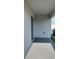 Covered patio featuring a sliding glass door and concrete flooring at 2880 Gumbo Limbo Dr, Wimauma, FL 33598