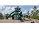 Community playground featuring a tall tower with slides and climbing features at 2880 Gumbo Limbo Dr, Wimauma, FL 33598