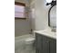 Updated bathroom featuring gray vanity, subway tile surround, and shower-tub combo at 29228 Yarrow Dr, Wesley Chapel, FL 33543
