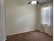 Bedroom featuring neutral walls, carpet, window with blinds, and ceiling fan at 29228 Yarrow Dr, Wesley Chapel, FL 33543