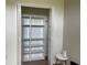 Organized closet with adjustable shelving and bi-fold doors, providing ample storage space at 29228 Yarrow Dr, Wesley Chapel, FL 33543