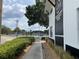 Exterior of community center with sidewalks and newly installed landscaping at 29228 Yarrow Dr, Wesley Chapel, FL 33543