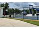 Fenced-in recreational area featuring a basketball court and pool with a slide at 29228 Yarrow Dr, Wesley Chapel, FL 33543
