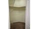 Empty walk-in closet with carpeted floors, shelving and door at 29228 Yarrow Dr, Wesley Chapel, FL 33543