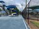Community waterpark featuring a large slide with blue flooring and secure fence at 29228 Yarrow Dr, Wesley Chapel, FL 33543