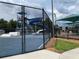Community waterpark featuring a large slide and splash pad area surrounded by a secure fence at 29228 Yarrow Dr, Wesley Chapel, FL 33543