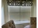 Close up view of dining window with blinds and valance providing privacy and light control at 29228 Yarrow Dr, Wesley Chapel, FL 33543