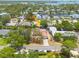 Aerial view of home on a tree-lined street, close to the water, with lush green landscaping at 315 Ridge Rd, Palm Harbor, FL 34683