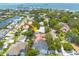 Stunning aerial view of a waterfront property highlighting its prime location and lush surroundings at 315 Ridge Rd, Palm Harbor, FL 34683