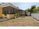 A well-kept backyard boasts a screened-in porch and jacuzzi, complemented by lush greenery and a shed at 315 Ridge Rd, Palm Harbor, FL 34683
