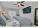 Comfortable bedroom with large flat screen TV and lots of natural light at 315 Ridge Rd, Palm Harbor, FL 34683