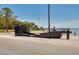 Unique boat structure with dock views, near a road in a scenic waterfront setting at 315 Ridge Rd, Palm Harbor, FL 34683